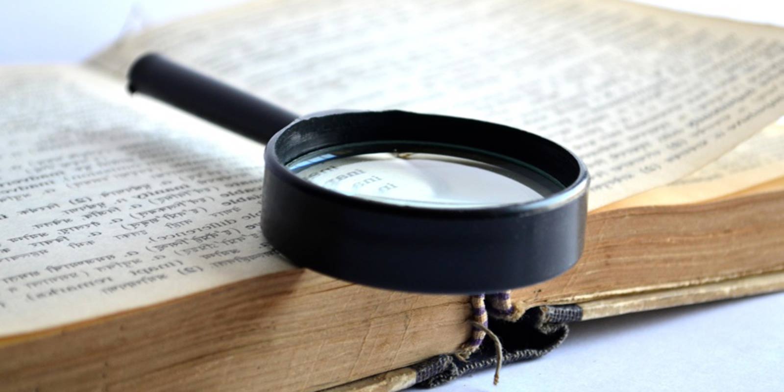 magnifying glass on book